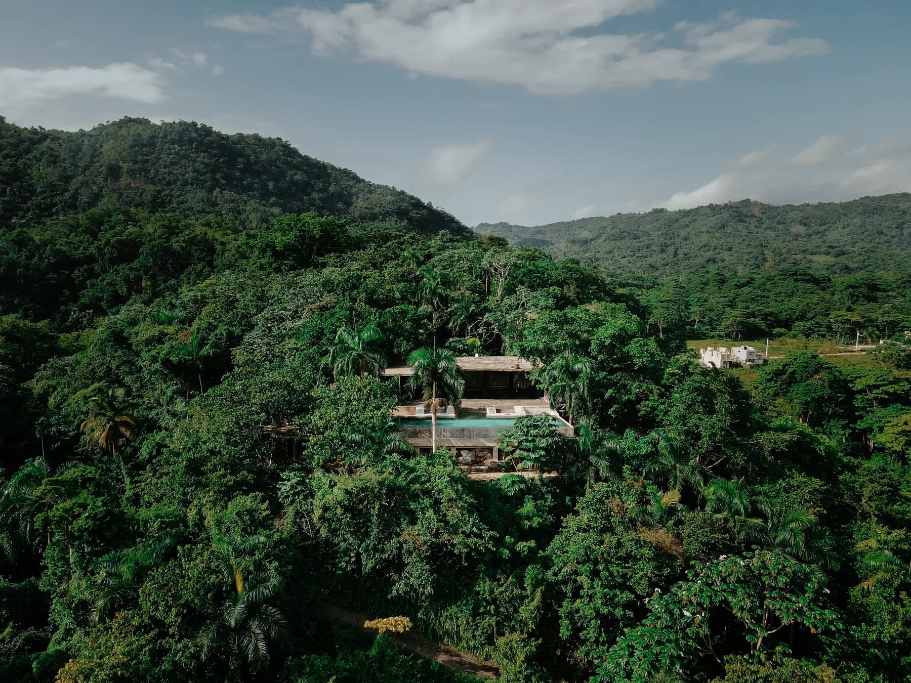 A secluded retreat setting surrounded by lush Caribbean hills